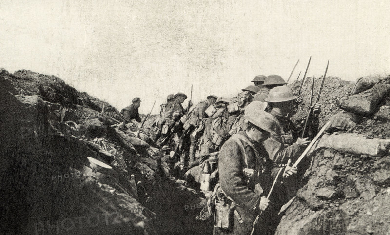 This photo shows Canadian troops who fought in World War I. The caption reads: Ready to go over—trenches Canadians WWI.  It appeared in Harold R Peat's book 'Private Peat' published in 1917.