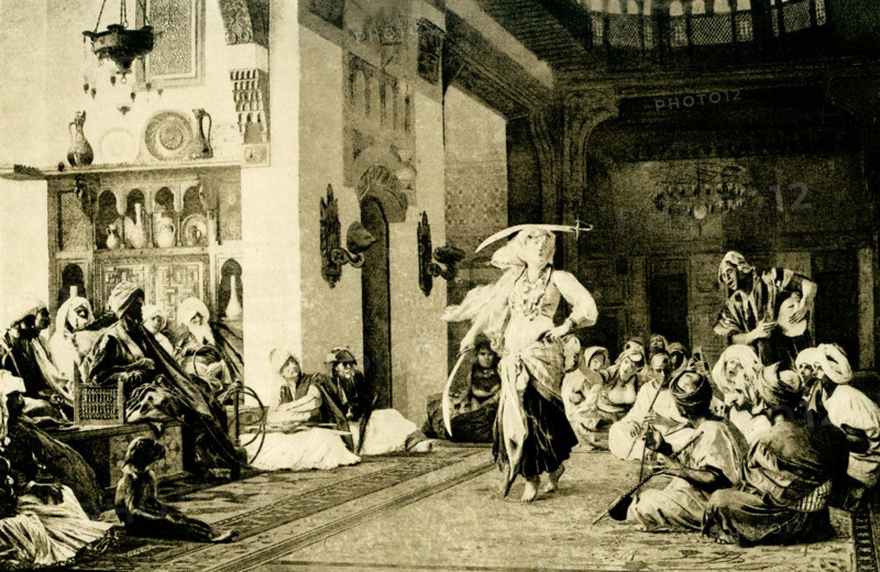 The caption on the 1904 image reads: The Sword Dance after a painting by Gerome. Jean-Léon Gérôme (1824 – 1904) was a French painter and sculptor in the style now known as academicism.