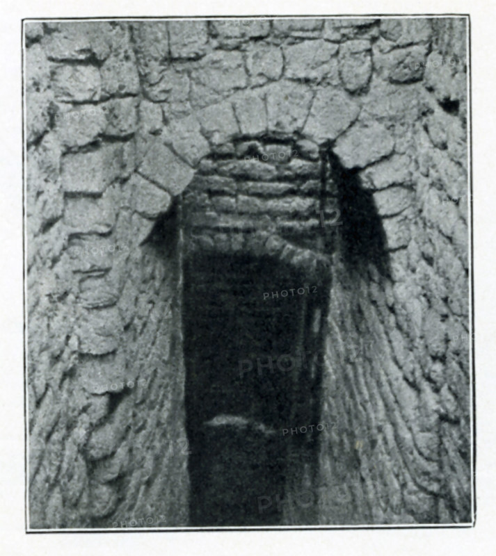 Shown in this early 1900s photo by British archaeologist John Garstang is a domed entrance to a brick tomb of the Old Kingdom. This Third Dynasty mudbrick tomb, along with others, was uncovered at Reqaqna, in Middle Egypt.