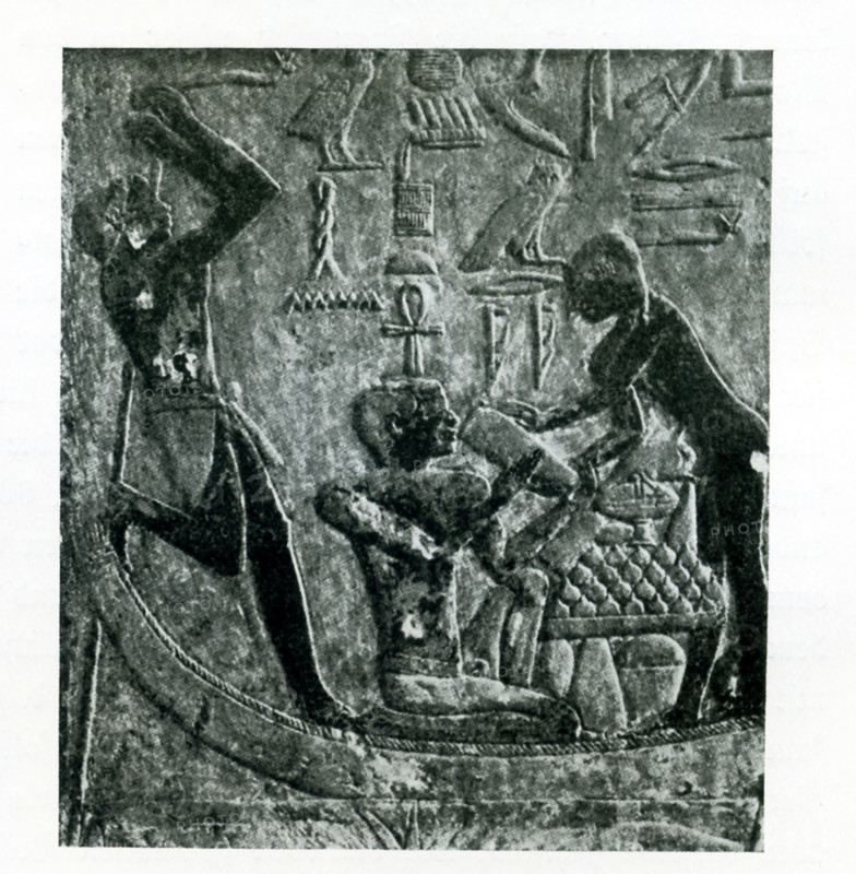 This carved relief from the tomb of Ptahhotep in Saqqara shows three figures. Ptahhotep was a common name in ancient Egypt. The illustration is credited to the Belgium art historian Jean Capart (1877-1947) and  Emil Roemmler (died 1941). The figure at leaft appears to be resting on his staff. The figure in the middle appears to be drinking, with the help of the figure on the right. Most likely the tomb was a Dynasty V timb.