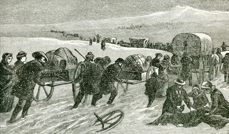 This illustration from 1896 shows a Mormon Hand-Cart Comoany crossing the Plains. The Mormon handcart pioneers were participants in the migration of members of The Church of Jesus Christ of Latter-day Saints to Salt Lake City, Utah, between 1856 and 1860. They used two-wheeled handcarts to transport their belongings. Two of the companies, the Willie and Martin companies, started their journey dangerously late in 1856 and were caught by heavy snow and severe temperatures in central Wyoming. Despite a dramatic rescue effort, more than 210 of the 980 pioneers in these two companies died along the way.