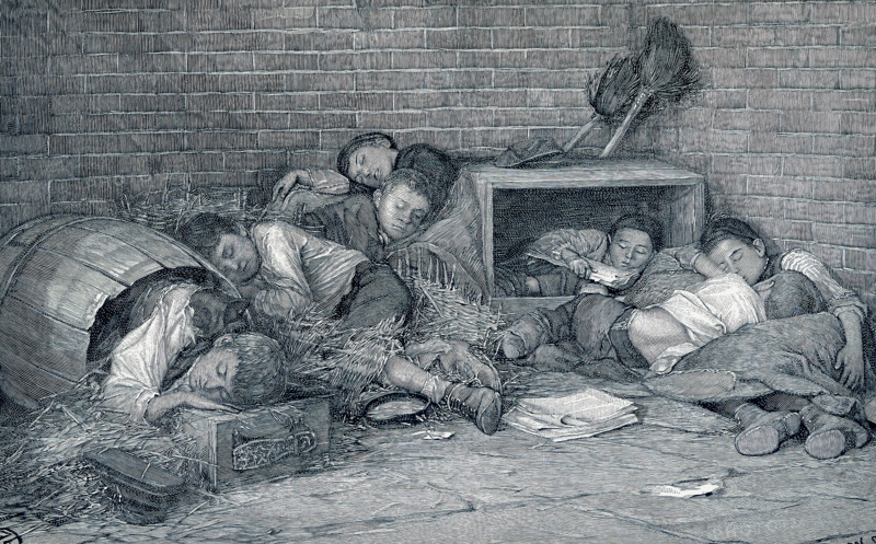 This late 19th-century illustration shows supperless and homeless street boys sleeping out at night - a night scene in an alley. Many of the newsboys and street boys of New York have no homes. Driven out from the alleys and by-ways of the slums, and from the dens in tenement districts, where most of them were born, they sell papers, black shoes, beg or steal, as need be, and sleep wherever night overtakes them. Their faces are old from constant exposure as well as from the struggle for existence. Their thin clothes afford small protection against winter's cold. It is not til one sees them at night curled up on some doorway in old barrels and empty packing boxes lying in any way and every sheltered spot in dark alleys or deserted hallways that one begins to realize that there is no softer pillow for them.