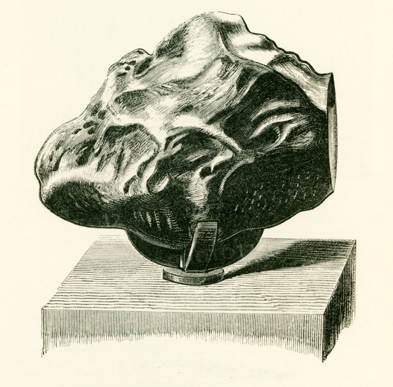 This illustration dates to the 1870s and shows an aerolite in the British Museum in London, England. The aerolites or meteoric stones, which fall onto Earth from outer space, consist usually of little else than metallic iron, alloyed with a little nickel. These meteorites are sometimes huge. One found in South America is calculated to weight 14 tons.