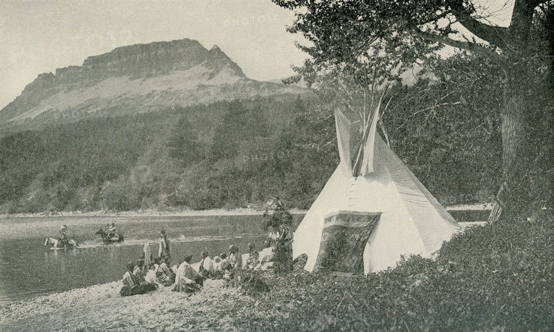This photo, which dates to 1922, shows Blackfeet Indians at their camp on St. Mary Lake in Montana, which is located on the east side of Glacier National Park. The Blackfeet call the lake ""the Backbone of the World."" This area is the home of the Blackfeet Indian Reservation.