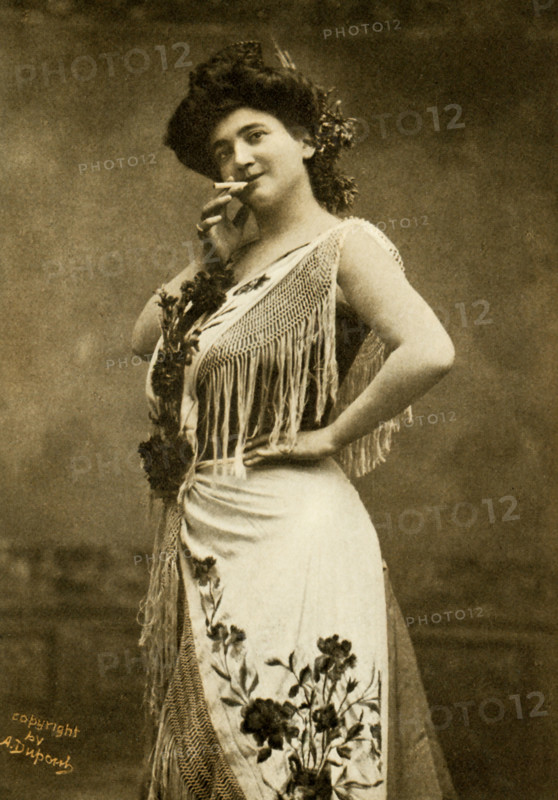 This photo shows the opera singer Emma Calve in the title role of Bizet's Carmen. She was born in 1866 in Decazeville, France, and made her operatic debut in Brussels in 1881, as Marguerite in Faust. She originated the role of Santuzza in Cavalleria Rusticana, but her greatest triumphs followed her first appearance in Carmen at the Opera Comique, Paris, in 1874. She first came to America in 1893 and then made yearly visits in grand opera and recitals.