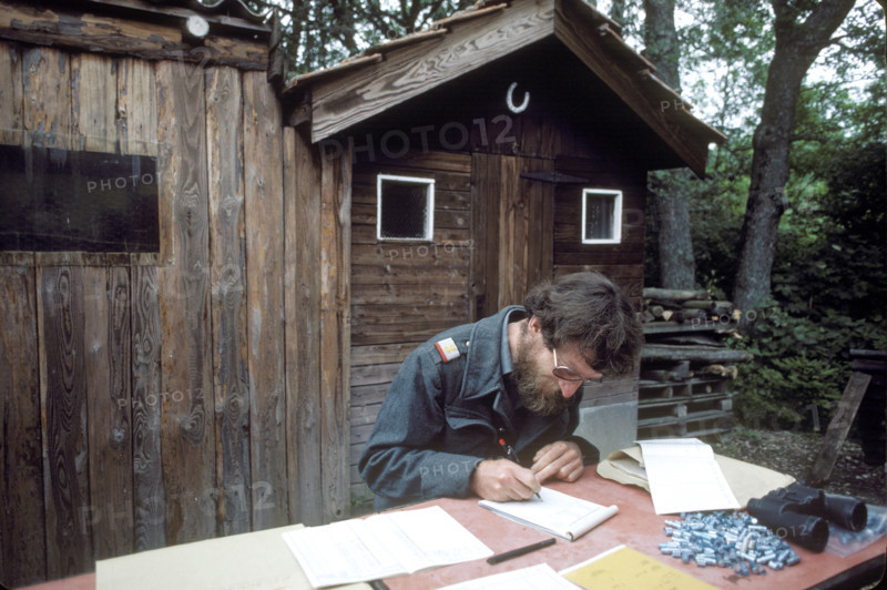 Soldier registering carrier pigeons, 1984.