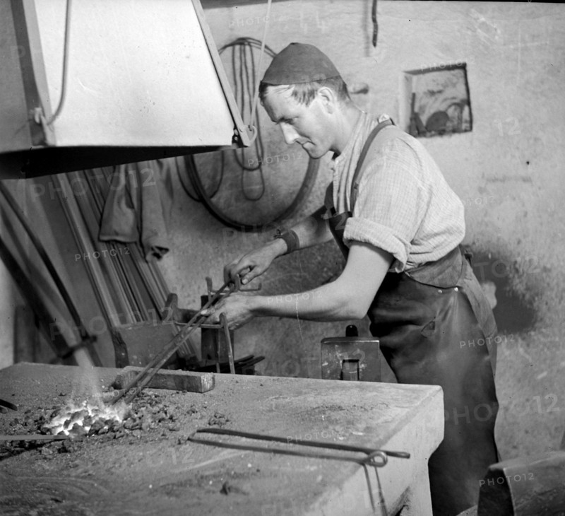 Forge, nailer making nails; 1940.