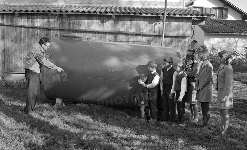 Joseph Buhlmann and family beside tank 1969.