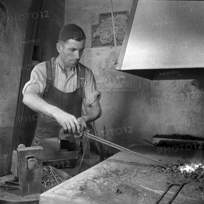 Forge, nailer making nails; 1940.