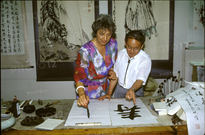 Catherine Delamuraz with calligrapher in China 1992.