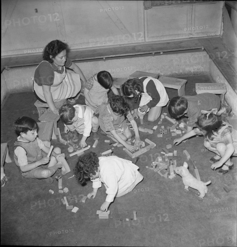 Children playing on the ground.