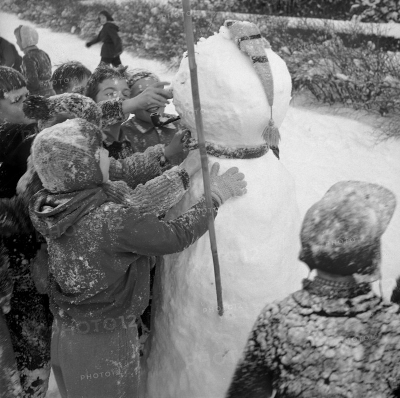 Building a snowman at schoolyard, Zurich-Wiedikon 1955.