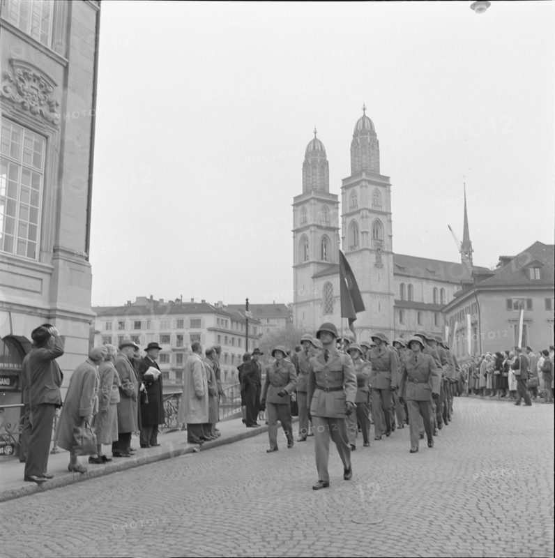 Military officers marching across Munsterbrucke, Zurich 1957.