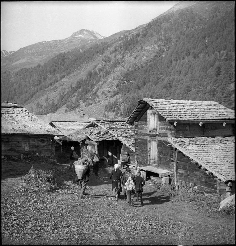 Farmers meet for cheese donation in the Turtmanntal valley, Switzerland, 1940.