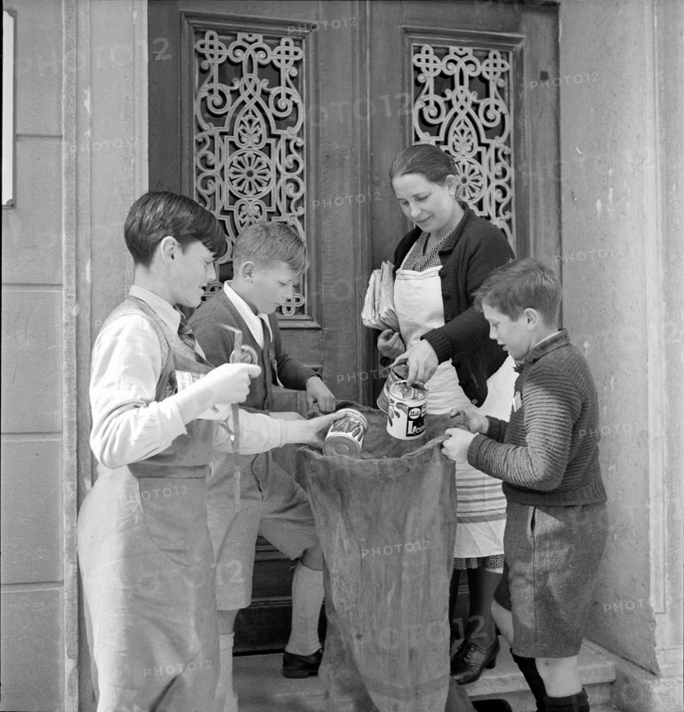 W K 2: war economics; young people collecting material to be recycled.