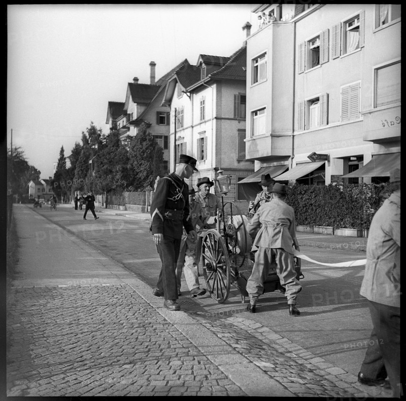 War fire brigade: men with hose cart, 1939.
