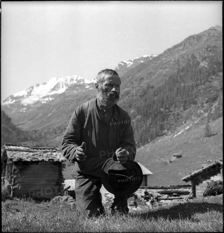 Farmer praying in the Turtmanntal valley, Switzerland, 1940