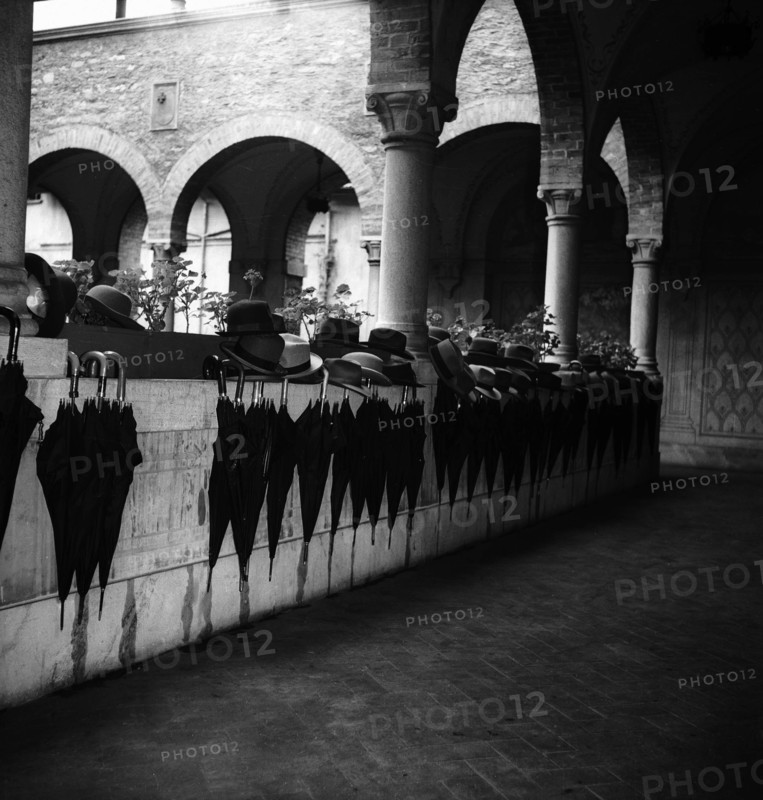 Umbrellas and hats during railway anniversary celebration in Bellinzona