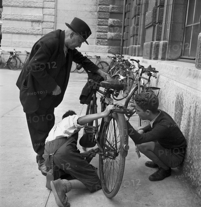 Basel, boys offer cleaning of bicycles; 1941