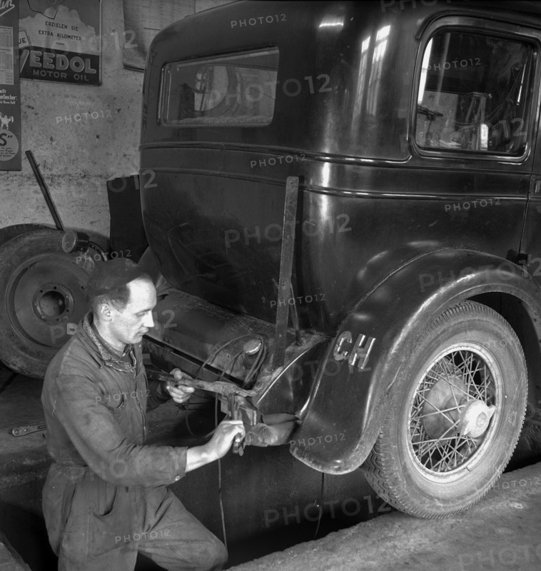 Motor mechanic at work; 1947