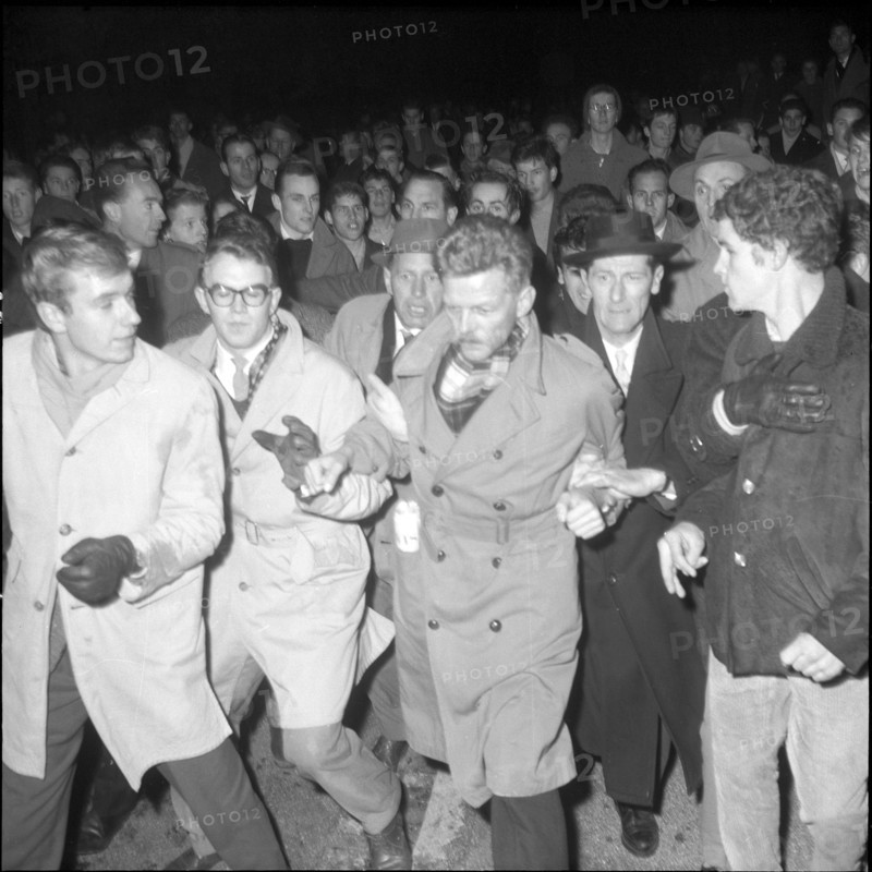 Demonstrators behind Armand Forel, invited guest; 1961