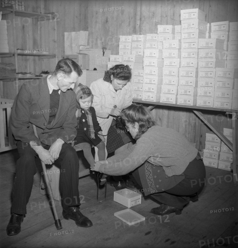 Disabled child getting new shoes, 1945