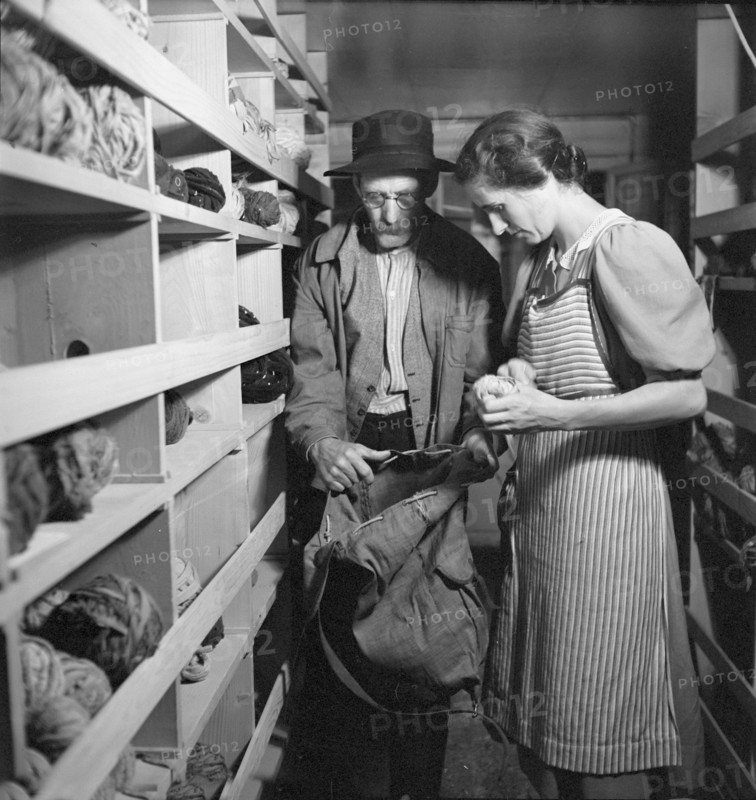 Woman choosing remnants, 1940