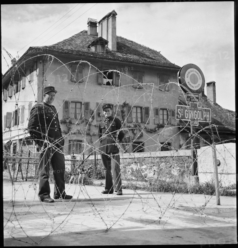 WW 2: French border guards behind barbwire barrage, St. Gingolph around 1943