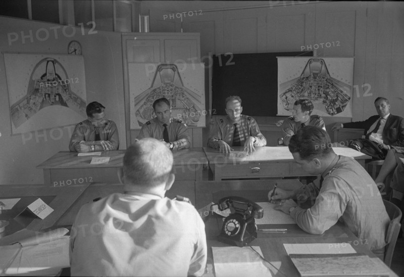 Military pilots discussing tactical exercise, Dübendorf 1963