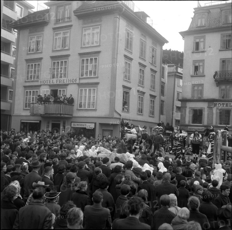 Throwing bread to the crowd, carnival custom in Einsiedeln, 1965