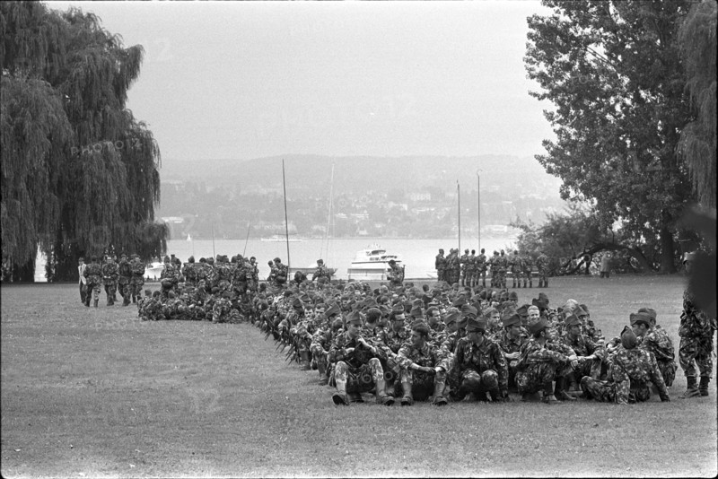 Military Parade 1969 in Switzerland: Soldiers having a rest in a park