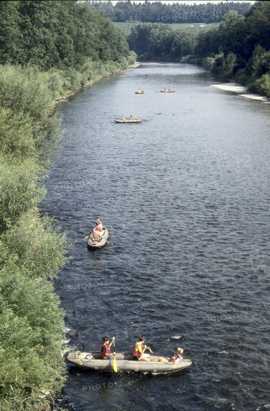 Children canoeing on river