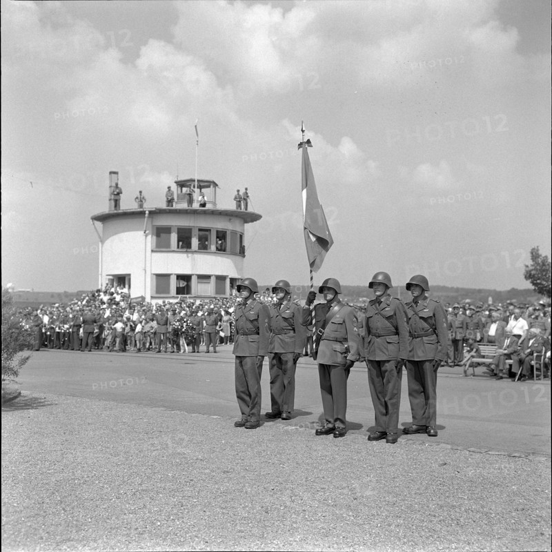 Soldiers with Swiss flag at air show, Dübendorf 1964