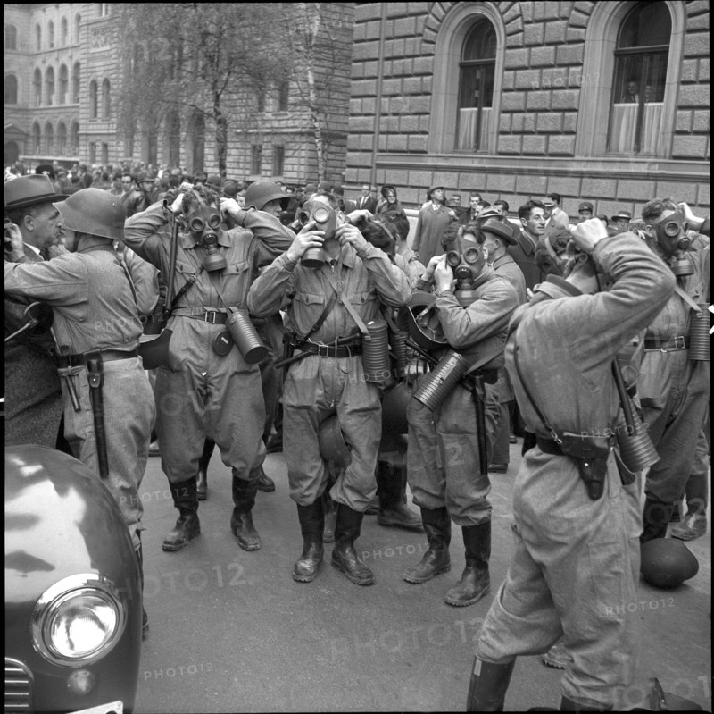 Policemen prepare for action; 1961