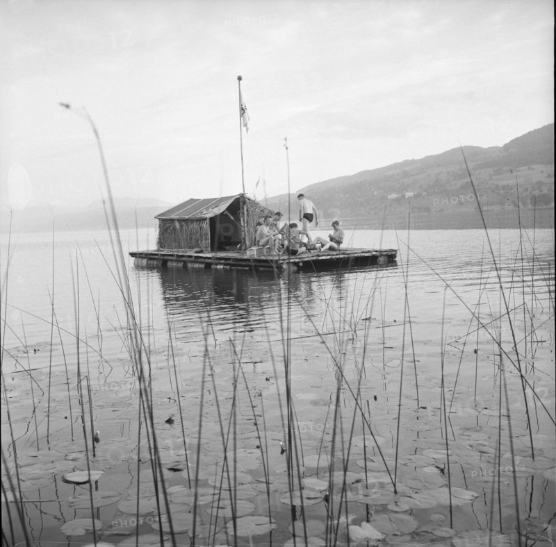 Teenagers spend their holiday on a self-made raft on the Lake Hallwil