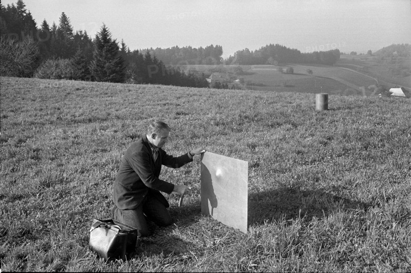 Nature and creatures are artistically treated; Attaching an explosive charge on iron plate Emmental hills arise