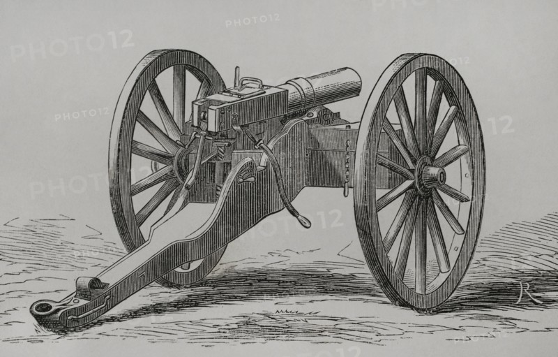 Christophe-Montigny Mitrailleuse. Hand-crank operated. It was developed by the Belgian arms factory of Joseph Montigny between 1859 and 1870. Two ammunition compartments for immediate use were mounted on both sides. Back view. Engraving. ""Historia de la Guerra de Francia y Prusia"" (History of the War between France and Prussia). Volume I. Published in Barcelona, 1870.