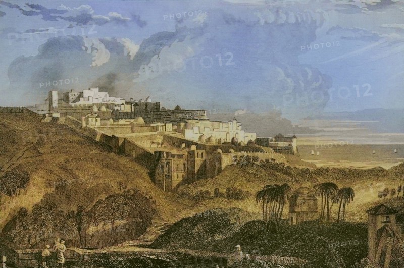 Jaffa. General view of the port city on the Mediterranean coast. Engraving by Ransonnette. Later colouration. ""La Tierra Santa y los lugares recorridos por los profetas, por los apostoles y por los cruzados"" (The Holy Land and the sites traversed by the prophets, by the apostles and by the crusaders). Published in Barcelona by the printing house of Joaquin Verdaguer, 1840.