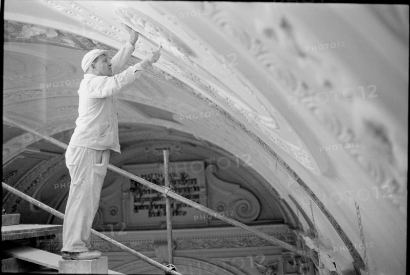 Stucco worker renovates the ceiling of the Predigerkirche Zurich 1966