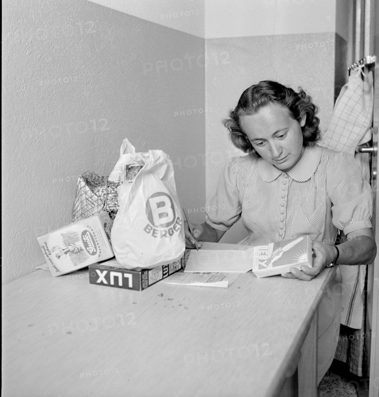 Young woman with her shopping; 1945