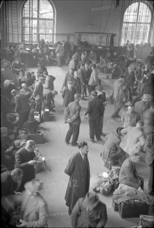 German internees waiting in the station hall. 1945