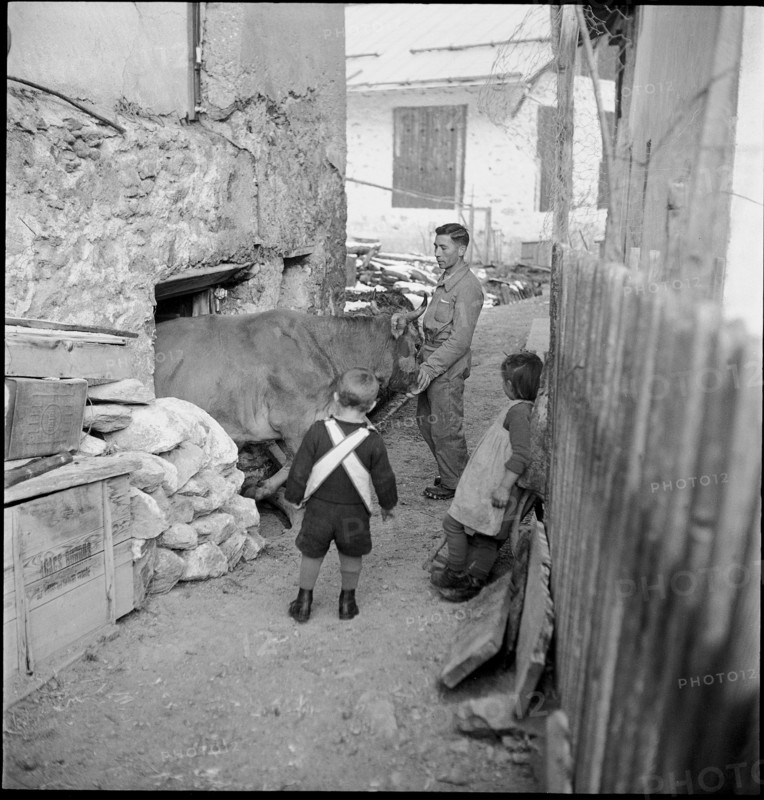 Woman doing laundry at fountain, 1946