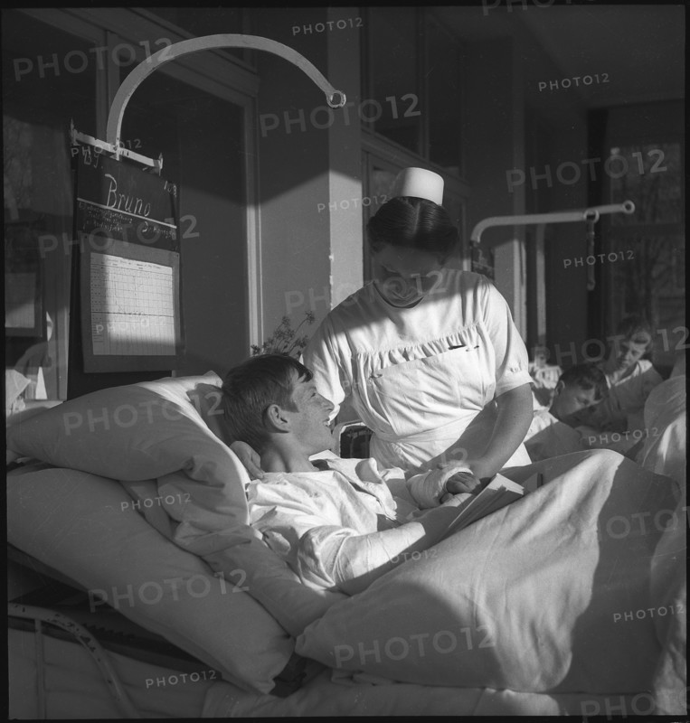 Nurse with patient in hospital 1943