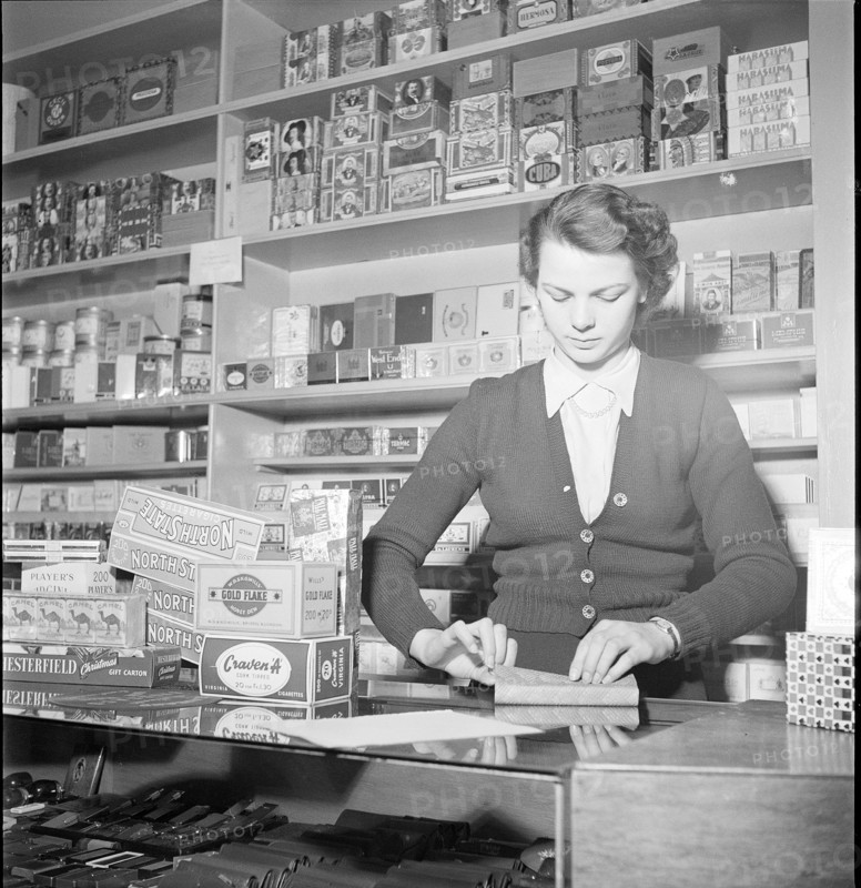 Davos, saleswoman in a tobacco shop; 1949
