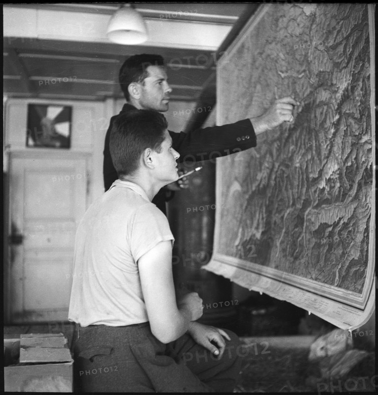 Polish internees look at a map of Switzerland; 1940