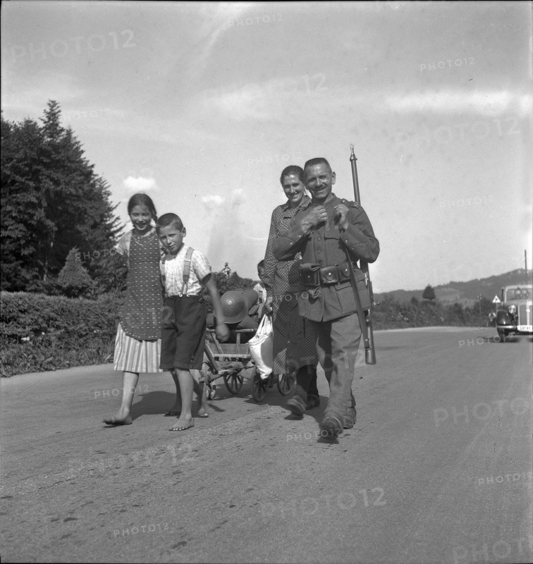 Soldier, returning home after discharge; 1940; 1940