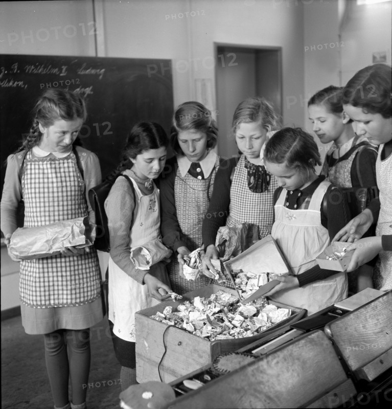 WW 2: economy of war; girls collecting tin tubes.