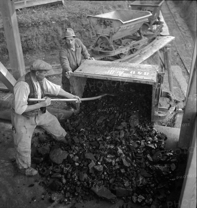 Miners; miner car in coal mine; 1941.