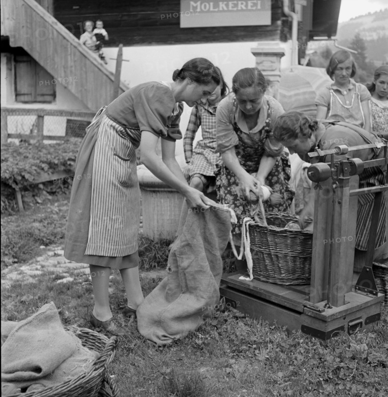 Unpacking and weighing remnants for rag rugs, 1940.