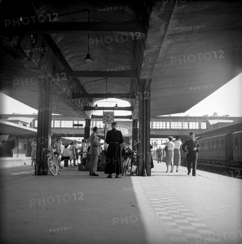 Strike in the Alsace: Travellers waiting at station, 1953.